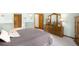 Comfortable bedroom with wood furniture, soft carpet, and ensuite bathroom at 3257 Sun Ridge Ln, Evergreen, CO 80439