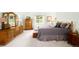 Relaxing primary bedroom with wood furniture, soft carpet, and lots of natural light at 3257 Sun Ridge Ln, Evergreen, CO 80439