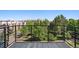 Balcony view of a park, with green trees and buildings in the distance at 7240 W Custer Ave # 417, Lakewood, CO 80226