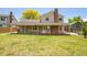 Expansive backyard featuring a covered patio, with green space for outdoor enjoyment at 5419 E 113Th Ave, Thornton, CO 80233