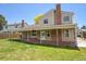 Backyard with covered patio and lush lawn perfect for entertaining at 5419 E 113Th Ave, Thornton, CO 80233