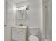 White bathroom featuring a vanity, toilet and glass door shower at 5419 E 113Th Ave, Thornton, CO 80233