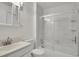 All-white bathroom with a combination shower-tub and vanity with drawers at 5419 E 113Th Ave, Thornton, CO 80233