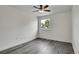 This bedroom features sleek gray floors, a modern ceiling fan, and a bright window at 5419 E 113Th Ave, Thornton, CO 80233
