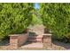 Tranquil garden entrance with brick pillars and stone steps at 5419 E 113Th Ave, Thornton, CO 80233