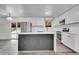 Modern kitchen with stainless steel appliances and quartz countertops at 5419 E 113Th Ave, Thornton, CO 80233