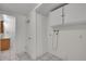 Well-lit laundry room with storage cabinets, tile floors, and washer hookups at 5419 E 113Th Ave, Thornton, CO 80233