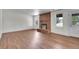 Bright and spacious living room with a brick fireplace and large windows for natural light at 5419 E 113Th Ave, Thornton, CO 80233