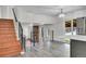 Bright open living space featuring stairs with metal railing and hardwood steps at 5419 E 113Th Ave, Thornton, CO 80233