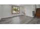 Spacious living room with wood-look flooring and natural light at 5419 E 113Th Ave, Thornton, CO 80233