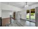 Bright open living space featuring stairs with metal railing and hardwood steps at 5419 E 113Th Ave, Thornton, CO 80233