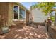Relaxing brick patio featuring a lounge chair, complimented by privacy fencing and landscaping at 5419 E 113Th Ave, Thornton, CO 80233