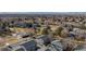 Aerial view of a well-maintained community featuring townhomes, green spaces, mature trees, and community pool at 1223 S Wheeling Way, Aurora, CO 80012