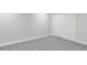 Unfinished basement featuring grey carpet and ample storage at 7154 S Hudson Cir, Centennial, CO 80122