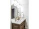 Modern bathroom with double vanity, updated fixtures, and stylish mirrors at 7154 S Hudson Cir, Centennial, CO 80122