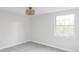 Simple bedroom with gray carpet and a large window at 7154 S Hudson Cir, Centennial, CO 80122