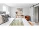 Main bedroom with barn door and neutral decor at 7154 S Hudson Cir, Centennial, CO 80122