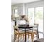 Kitchen dining area with round black table and four light chairs at 7154 S Hudson Cir, Centennial, CO 80122