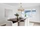 Elegant dining room with large window and wood table at 7154 S Hudson Cir, Centennial, CO 80122