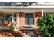 House exterior showcasing a brick and siding facade, and double front doors at 7154 S Hudson Cir, Centennial, CO 80122