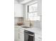 Modern kitchen sink with gold faucet and white quartz countertop at 7154 S Hudson Cir, Centennial, CO 80122