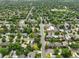 A tranquil neighborhood featuring tree-lined streets and well-maintained homes from an aerial view at 2957 S York St, Denver, CO 80210