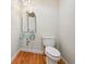 Elegant powder room with glass sink bowl, modern faucet and light fixture at 2957 S York St, Denver, CO 80210