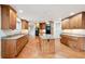 Spacious kitchen with custom wood cabinets, granite countertops, and stainless appliances at 2957 S York St, Denver, CO 80210
