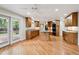 Large kitchen with custom cabinets, granite countertops, an island and backyard access at 2957 S York St, Denver, CO 80210