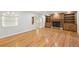 Bright living room featuring hardwood flooring, a fireplace, and open archway to front door at 2957 S York St, Denver, CO 80210