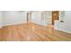 Spacious living room featuring gorgeous hardwood floors and bright, white walls at 2957 S York St, Denver, CO 80210