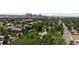 Beautiful aerial view of a park surrounded by a residential neighborhood, with the city skyline in the distance at 2040 W 45Th Ave, Denver, CO 80211