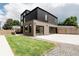 Stunning modern home with unique architectural design, a lush lawn, and an attached garage at 2040 W 45Th Ave, Denver, CO 80211