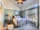 Bright bedroom with high ceilings and a ceiling fan at 9633 Brentwood Way # B, Broomfield, CO 80021