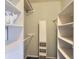 Large walk-in closet with built-in shelving and rods at 9633 Brentwood Way # B, Broomfield, CO 80021