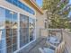 Private deck with wooden flooring and seating, overlooking the community at 9633 Brentwood Way # B, Broomfield, CO 80021