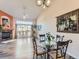 Bright dining area with glass table and chairs, adjacent to the living room at 9633 Brentwood Way # B, Broomfield, CO 80021