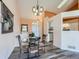 Cozy dining area with a glass-top table and views of the entryway at 9633 Brentwood Way # B, Broomfield, CO 80021