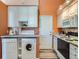 Efficient kitchen with washer, dryer, and modern appliances at 9633 Brentwood Way # B, Broomfield, CO 80021