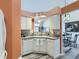 Efficient kitchen with white cabinetry and modern appliances at 9633 Brentwood Way # B, Broomfield, CO 80021