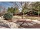 Backyard with a manicured lawn and stone walkway at 580 Crossing Cir, Castle Pines, CO 80108