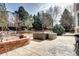 Outdoor patio area with seating and a fire pit at 580 Crossing Cir, Castle Pines, CO 80108