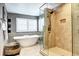 Modern bathroom featuring a glass-enclosed shower, soaking tub, and stylish fixtures at 580 Crossing Cir, Castle Pines, CO 80108