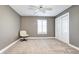 Bedroom featuring neutral colors, carpeted floor, closet and shuttered window at 580 Crossing Cir, Castle Pines, CO 80108