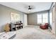 Well-lit bedroom with playful decor, a window seat, and neutral carpeting at 580 Crossing Cir, Castle Pines, CO 80108