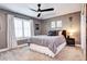 Bedroom with a neutral color scheme, fan, window and curtains at 580 Crossing Cir, Castle Pines, CO 80108