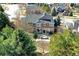 Two-story home with a multi-level patio and lush landscaping at 580 Crossing Cir, Castle Pines, CO 80108