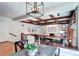 Inviting living room shows the ceiling beams, and a fireplace at 580 Crossing Cir, Castle Pines, CO 80108