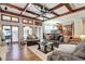 Open living room with ample seating, fireplace, and connection to the kitchen area at 580 Crossing Cir, Castle Pines, CO 80108