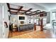 Stunning living room with coffered ceilings, fireplace, hardwood floors, and custom built-ins at 580 Crossing Cir, Castle Pines, CO 80108